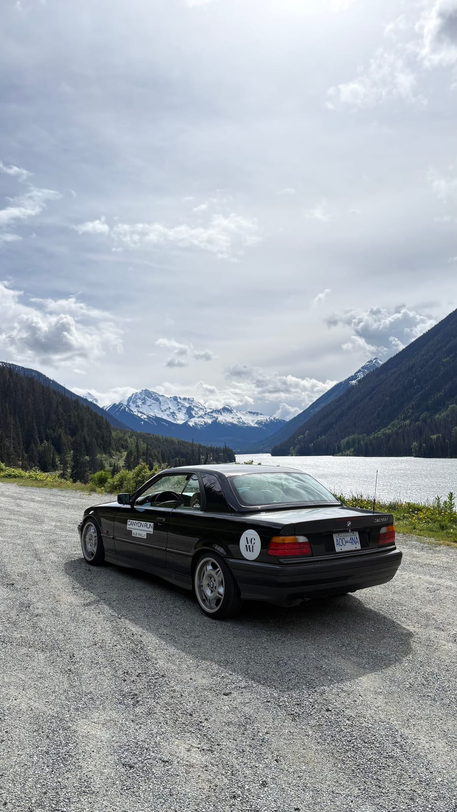 The finished E36 328i parked beside a mountain lake during the Canyon Run rally